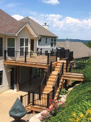 Completed Deck with new cedar flooring and aluminum rail system.