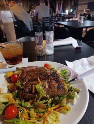 ~slightly off menu combining their rib eye steak (very well prepared BTW) on a salad that the menu has it w/ chicken