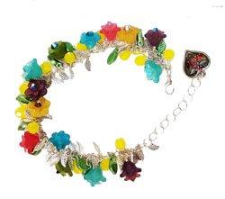 A Swarovski and Lucite flower bracelet. A wonderful combo of Crystal, Plastic and metal components. An example of what can be made