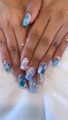 Nontoxic dip powder nails and hybrid tap gel nails with hand drawn nails art in 3-D style and rhinestone with fresh embedded flowers