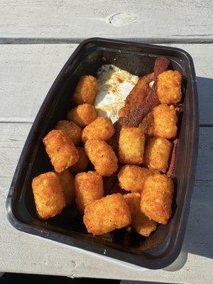 Create your own breakfast platter, tots, over easy eggs and bacon.