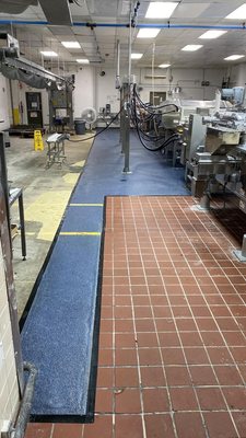 seamless install of epoxy and colored quartz to replace eroded and worn tile at  food processing facility 2022