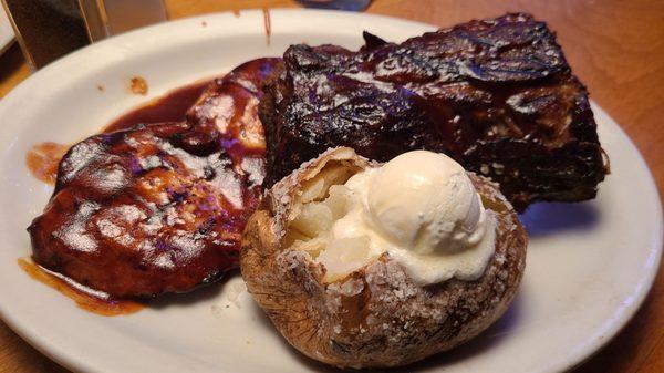 Ribs and Chicken Dinner served with baked potato and chili