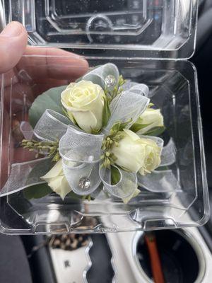 Beautiful wristlet corsage with white spray roses, and eucalyptus.