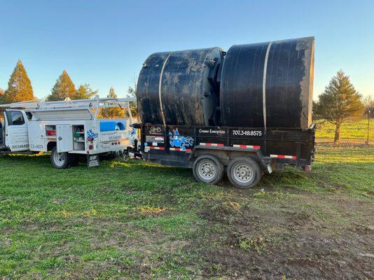 Transporting two water tanks to a happy customer.