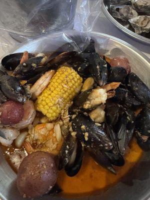 Black mussels, shrimp and plenty of garlic/butter with more on the side. Also had the steamed oysters.  So delicious, all of it.