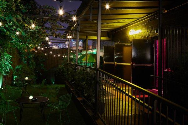 This is the outside patio of The Blue Room, where patio seating, a photobooth, and restrooms are located.