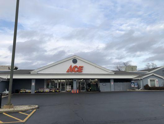 Huge storefront along with a huge parking lot.