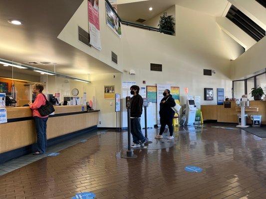 Patients checking in at the front desk.