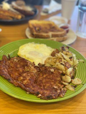 Corn beef and hash with easy over eggs and rye toast