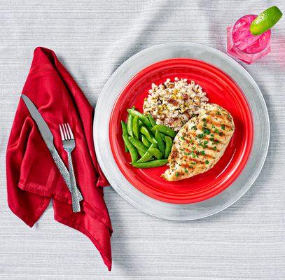 Cage Free Chicken Karahi, served with Tri-Colored Pearl Couscous, Grilled Organic Zucchini and Yellow Squash.