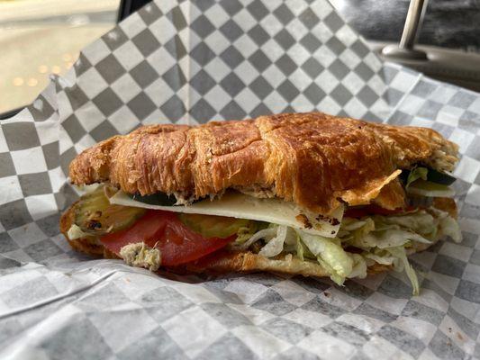 Tuna sandwich, toasted, on a croissant. Fully customizable. I added havarti, tomatoes, lettuce and pickles.