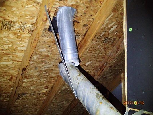 Roofing Contractor unknowingly disconnected the flue pipe when replacing the roof.