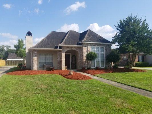 Tidied up this yard! That red mulch and green grass just pops!