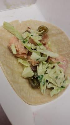 Smoked salmon taco with avocado cilantro slaw and pickled jalapeños. Yum!!!