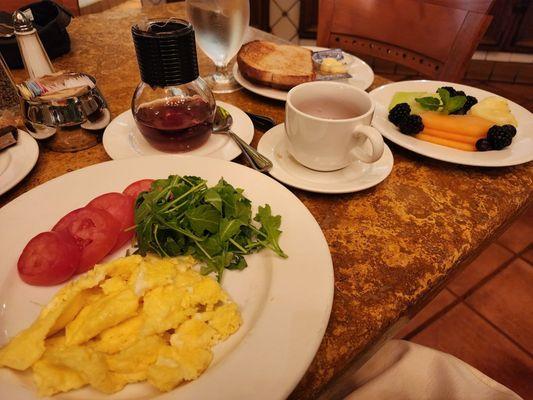 Scrambled eggs, fruit