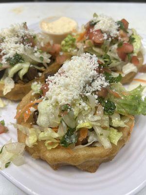 Sopes de asada, chorizo, pollo, camarón, pescado .   We also have Vegan Sopes