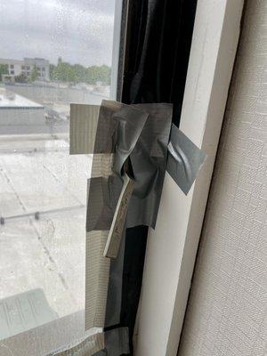 Duct taped window in room