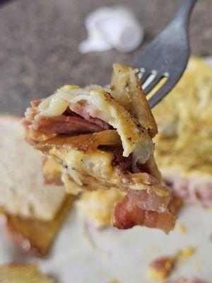 The Paul's Omelet with ham, bacon, and cheese. Served with Homefries and white toast with butter and jelly.