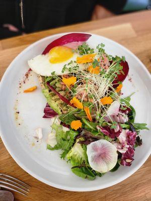 Avocado toast with salmon and egg toppings