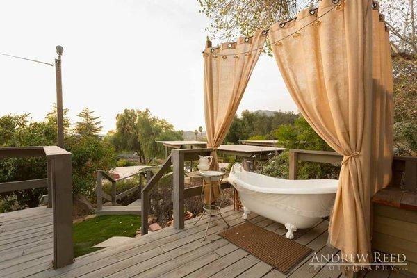 Outdoor victorian bathtub install.