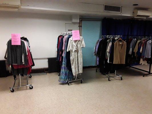 One of two racks of WOMEN'S CLEARANCE clothes