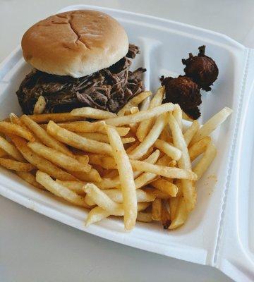 Brisket Sandwich with the seasoned shoo string fries on the side..and some fun hush puppies!