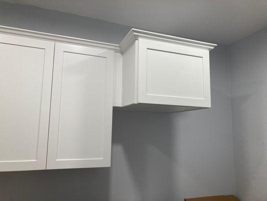 Installed cabinets, custom work to make fit.