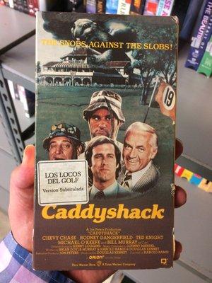 "Caddyshack"...er..."Los Locos Del Golf"...on VHS. It smelled of cigars and baby poop.