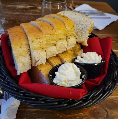 Delicious fresh bread baked with herbs and served with butter. One of my favorite parts of the meal!