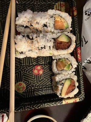 Salmon Avocado Roll Spicy Tuna Roll w/ avocado. Phone did not eat first.