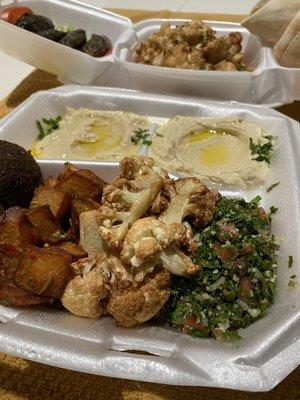 Abu Ali Sampler, sub batata harra & cauliflower instead of kibbeh. Vegan grape leaves and cauliflower in addition to sampler in background.