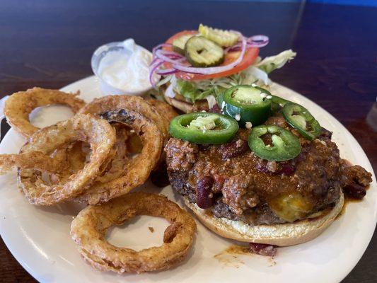 Chili cheeseburger and onion rings.