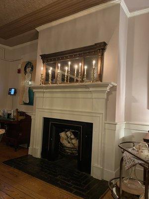 Charming mantle in the main dining room