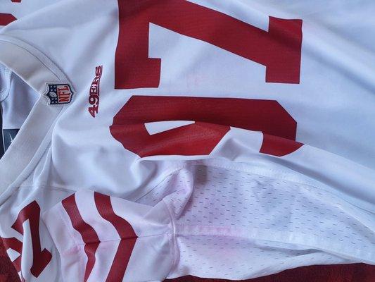 49ers Jersey stains, I have had it for TWO days it stained itself the longer I had it on! And all I got was a I'm sorry I can't help you.