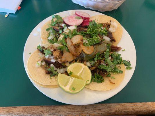 A Glorious plate of five carnitas soft tacos.