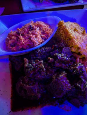 Oxtails baked macaroni and cheese with carrot salad.