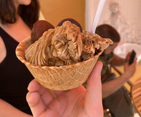 coffee ice cream with brownie bites, in waffle bowl