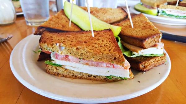 Smoked Turkey Sandwich - Smoked Turkey, House Made Oat Bran Bread, Tomato, Lettuce, Ranch and Lemon Garlic Dressings