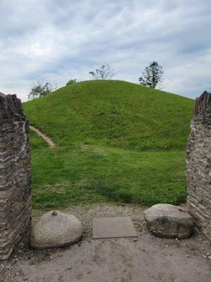 Mound as seen from the entryway between the two stone columns