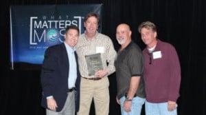 Desert Hot Tubs owner and team members accept Territory Dealer of Year Award. Visit Desert Hot Tubs to discover your best hot tub ownership