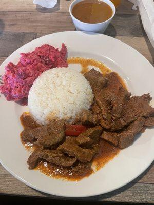 Carne guisada with white rice, beans, and ensalada rusa