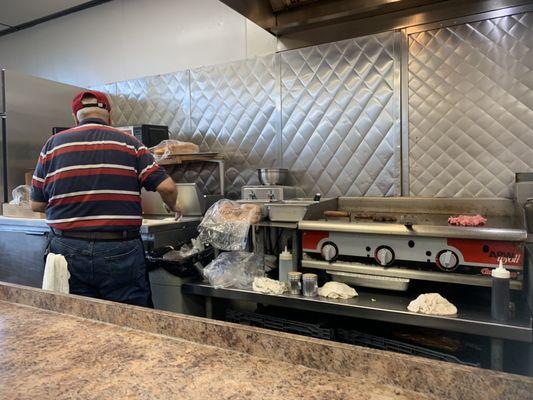 Dad in prep area with grill that is his domain.