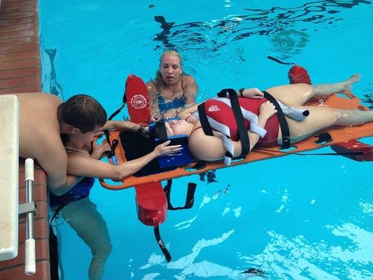 Lifeguard candidates learning to Backboard at The Colony Aquatic Park