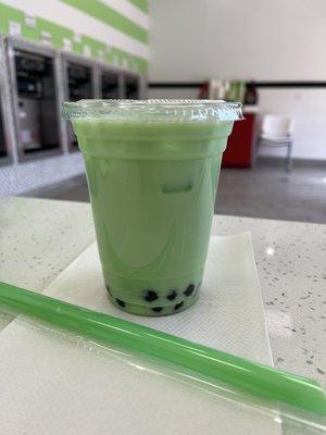 Honey dew bubble tea with boba.