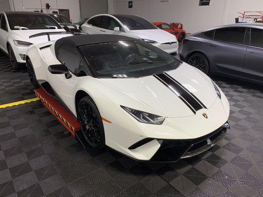 Lamborghini Huracan With Full from coverage in XPEL Ultimate and custom Gloss black stripes.