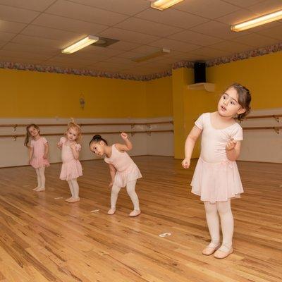 Warming up is so important! Our littlest stars start each class moving and stretching to warm their muscles and minds.