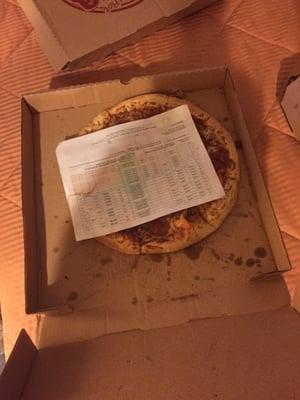 This is supposedly a 16 inch pizza. That is an 8.5 by 11 inch piece of paper laying on top of it.