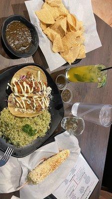 Two Tacos Plate all rice! Pineapple mojito, elote, & Chips and Salsa. Shot of 1800 resposado