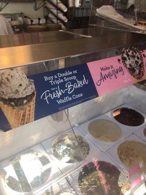 It clearly reads - Buy a Double Scoop or Triple Scoop Get a Fresh-Baked Waffle Cone